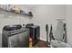 Well-organized laundry room with modern washer and dryer and convenient shelving for storage at 1340 Valor Rd., Conway, SC 29527