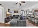 Cozy living room featuring comfortable seating, a ceiling fan, and an open view to the kitchen at 1340 Valor Rd., Conway, SC 29527