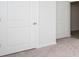 Bedroom with carpet, white walls and two doors at 144 Ashworth Dr., Tabor City, NC 28463