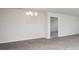 Dining room features light gray flooring and a chandelier at 144 Ashworth Dr., Tabor City, NC 28463