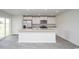 Modern kitchen featuring a center island, stainless steel appliances, and a sliding glass door to the patio at 144 Ashworth Dr., Tabor City, NC 28463