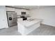 Spacious kitchen featuring modern appliances, a center island, and beautiful flooring at 144 Ashworth Dr., Tabor City, NC 28463