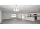 Open-concept living area with a kitchen featuring stainless appliances, and a view of the dining space at 144 Ashworth Dr., Tabor City, NC 28463