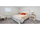 Bedroom with neutral carpet, bed, and two bedside tables at 147 Ashworth Dr., Tabor City, NC 28463