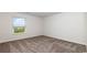 Bright bedroom featuring neutral carpet and a window with community views at 147 Ashworth Dr., Tabor City, NC 28463
