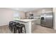 Open kitchen featuring a large island with seating and stainless steel appliances at 147 Ashworth Dr., Tabor City, NC 28463