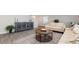 Cozy living room with a modern farmhouse design, including a round wood table and neutral-toned sofa at 147 Ashworth Dr., Tabor City, NC 28463