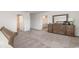 Main bedroom features a walk-in closet, dresser, and bathroom at 147 Ashworth Dr., Tabor City, NC 28463