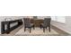 A home office with a desk, chairs, and dark wood-look flooring at 147 Ashworth Dr., Tabor City, NC 28463