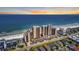 Stunning aerial view of the beachfront condo complex, showcasing its prime location and beautiful surroundings at 1690 N Waccamaw Dr. # 1008, Garden City Beach, SC 29576