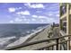 Expansive beach view from a high rise balcony overlooking the coastline at 1690 N Waccamaw Dr. # 1008, Garden City Beach, SC 29576