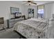 Bright bedroom with a ceiling fan, balcony access and ocean view at 1690 N Waccamaw Dr. # 1008, Garden City Beach, SC 29576