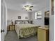 Cozy bedroom with a ceiling fan and bright lighting, great for relaxing at 1690 N Waccamaw Dr. # 1008, Garden City Beach, SC 29576