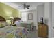 Relaxing bedroom with bright colors and ceiling fan providing comfort at 1690 N Waccamaw Dr. # 1008, Garden City Beach, SC 29576