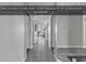 Tiled hallway leading to living spaces with neutral decor at 1690 N Waccamaw Dr. # 1008, Garden City Beach, SC 29576