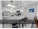 Kitchen with a skylight and white cabinets at 1690 N Waccamaw Dr. # 1008, Garden City Beach, SC 29576