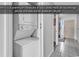 Convenient in-unit laundry closet with a stacked washer and dryer, adding practicality to the home at 1690 N Waccamaw Dr. # 1008, Garden City Beach, SC 29576