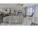 Inviting living room with ocean views, tile floors, and comfortable seating, perfect for relaxation at 1690 N Waccamaw Dr. # 1008, Garden City Beach, SC 29576