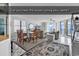 Bright living room features a dining area and ocean views from windows and balcony access at 1690 N Waccamaw Dr. # 1008, Garden City Beach, SC 29576