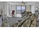 Living room featuring ocean views, comfortable seating, and bright natural light, creating a relaxing atmosphere at 1690 N Waccamaw Dr. # 1008, Garden City Beach, SC 29576