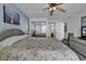 Spacious main bedroom with mirrored closet doors, balcony views, and comfortable furnishings at 1690 N Waccamaw Dr. # 1008, Garden City Beach, SC 29576