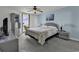 Cozy main bedroom with balcony access, offering natural light, a ceiling fan, and scenic views at 1690 N Waccamaw Dr. # 1008, Garden City Beach, SC 29576