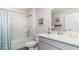 Well-lit bathroom featuring a shower tub, white vanity and elegant decor at 164 Ashworth Dr., Tabor City, NC 28463