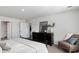 Comfortable bedroom with neutral tones, featuring a dark dresser and cozy chair at 164 Ashworth Dr., Tabor City, NC 28463