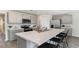 Modern kitchen featuring an island with seating, stainless steel appliances, and ample cabinetry at 164 Ashworth Dr., Tabor City, NC 28463