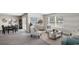 Inviting living room featuring modern furnishings, natural light, and an open flow to the dining area at 164 Ashworth Dr., Tabor City, NC 28463
