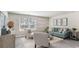 Comfortable living room featuring a plush sofa, stylish seating, and an abundance of natural light at 164 Ashworth Dr., Tabor City, NC 28463