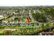 Aerial shot highlighting a residential property with a backyard pool and green space in a community at 176 Somerworth Circle, Surfside Beach, SC 29575