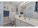Bathroom with a large mirror and vanity with storage space and a shower at 176 Somerworth Circle, Surfside Beach, SC 29575