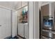 Convenient laundry closet with washer, dryer, shelving, and storage space at 176 Somerworth Circle, Surfside Beach, SC 29575