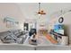 Inviting living room featuring a large sectional sofa and open-concept layout at 176 Somerworth Circle, Surfside Beach, SC 29575