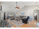 Spacious living room with neutral tones, ceiling fan, and hardwood floors at 176 Somerworth Circle, Surfside Beach, SC 29575