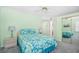 The bedroom is painted in light green and features a queen bed and sliding door closet at 1950 Bent Grass Dr. # K, Surfside Beach, SC 29575