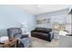 Comfortable bedroom with soft blue walls, a recliner, a sofa, a desk and a dresser, offering a peaceful escape at 1950 Bent Grass Dr. # K, Surfside Beach, SC 29575