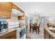 The dining area complements the kitchen with a view of a hallway to other rooms in the home at 1950 Bent Grass Dr. # K, Surfside Beach, SC 29575