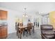 This dining area features a table, chairs, chandelier, and unique mirrored wall decorations at 1950 Bent Grass Dr. # K, Surfside Beach, SC 29575
