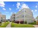 Well-maintained condo building with manicured landscaping, offering a comfortable and inviting atmosphere at 1950 Bent Grass Dr. # K, Surfside Beach, SC 29575
