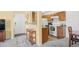 Well-appointed kitchen features white appliances and wood cabinets and connects to open living area at 1950 Bent Grass Dr. # K, Surfside Beach, SC 29575