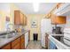This well-lit kitchen features stainless steel appliances, wood cabinets, and sleek countertops at 1950 Bent Grass Dr. # K, Surfside Beach, SC 29575