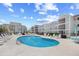 Refreshing community pool surrounded by lounge chairs, perfect for relaxation and recreation at 1950 Bent Grass Dr. # K, Surfside Beach, SC 29575