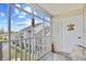 Inviting screened porch with serene views, comfortable seating and charming decor at 1950 Bent Grass Dr. # K, Surfside Beach, SC 29575