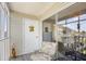 Cozy screened porch with a charming door decoration and comfortable seating, perfect for relaxation at 1950 Bent Grass Dr. # K, Surfside Beach, SC 29575