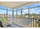 Relaxing screened porch with serene water views and comfortable seating, ideal for outdoor enjoyment at 1950 Bent Grass Dr. # K, Surfside Beach, SC 29575