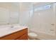 Well-lit bathroom featuring a tub-shower combo with white tiling and a wooden vanity with sink at 200 Palm Terrace Loop, Conway, SC 29526