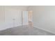Neutral bedroom with carpet, a double closet and an entry door that leads to the front foyer at 200 Palm Terrace Loop, Conway, SC 29526