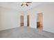 Spacious bedroom featuring carpet, natural light, and ensuite bathroom access at 200 Palm Terrace Loop, Conway, SC 29526